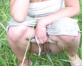 Brunette girl posing, pissing in stoop and drinking it.