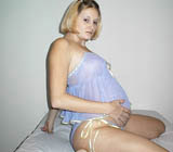 Watch these two pregnant lesbian girls have lots of fun on the couch
