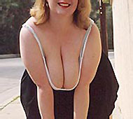 Horny babe with a big body posing