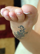 Angel red pedicured toes