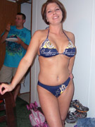 Sexy busty babe in lingerie getting naked