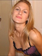 Blonde and busty nicole strips out of her long dress and poses