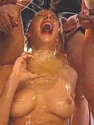 Chick gets on a stepladder to pee on her girlfriend