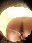 Guy pissing on brunette's tee and into her mouth