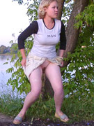 Gals in leather outfits squat down and take a leak