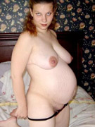 Sex-starved preggo in net-wide nylons drills her twat with a smooth shiny dildo
