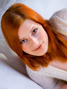 Redhead rose shows off her big boobs and plays with a toy